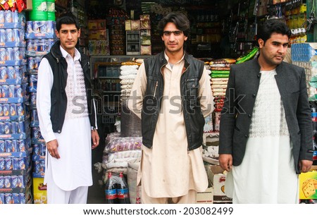 HERAT, AFGHANISTAN - OCT 28: Unidentified Afghan men on the street on October 28, 2012 in Herat, Afghanistan. Herat is the third largest city of Afghanistan, with a population of about 450,000.