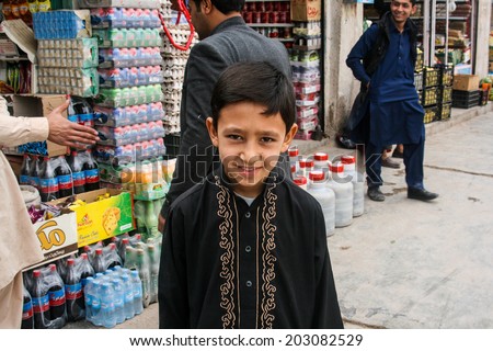 HERAT, AFGHANISTAN - OCT 28: Unidentified Afghan boy on the street on October 28, 2012 in Herat, Afghanistan. Herat is the third largest city of Afghanistan, with a population of about 450,000.