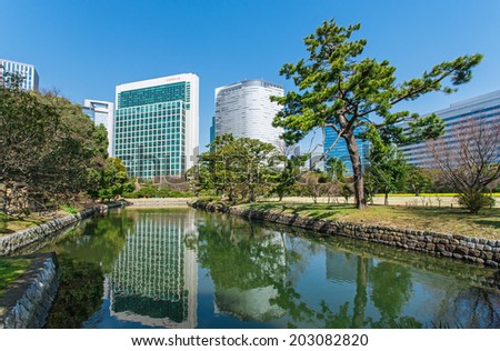 TOKYO - MARCH 24: View of skyscrapers from the Hama-rikyu Gardens in the Tokyo Bay area on March 24, 2014 in Tokyo, Japan. The Tokyo Bay region is the most populous and industrialized area in Japan.