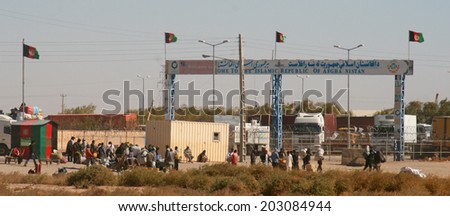 ISLAM QUALA, AFGHANISTAN - OCT 21: The border checkpoint between Iran and Afghanistan on October 21, 2012 at Islam Quala, Afghanistan. Trade between Afghanistan and Iran passes through Islam Quala.