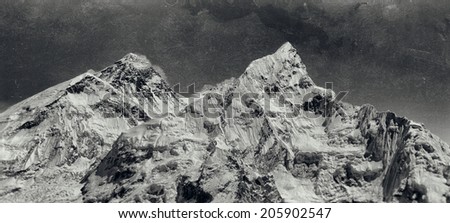 Vintage style black and white image of the world\'s highest mountain, Mt Everest (8850m) and Mt. Nuptse in the Himalayas, Nepal.