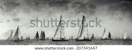 Vintage style black and white image of a sailing regatta on the sea
