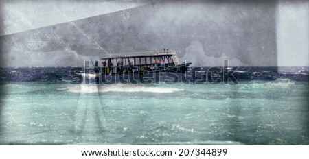 Vintage style image of a fishing boat on the Indian Ocean at the Maldives. The fishing industry in the Maldives is the island\'s second main industry.