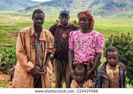 LAKE BUNYONYI, UGANDA - OCTOBER 21: Unidentified Batwa pygmy family on October 21, 2012 at Lake Bunyonyi, Uganda. Pigmy people are ancient dwellers in the forests, they were known as \'The Keepers of the Forest\'
