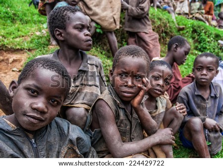 LAKE BUNYONYI, UGANDA - OCTOBER 21: Unidentified Batwa pigmy boys on October 21, 2012 at Lake Bunyonyi, Uganda. Pigmy people are ancient dwellers in the forests, they were known as \'The Keepers of the Forest\'