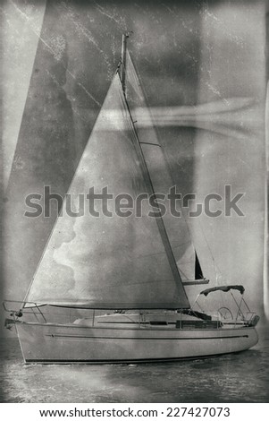 Vintage style black and white image of a sailing boat
