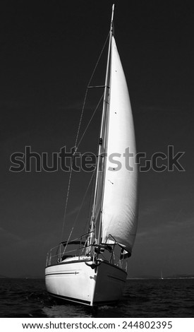 Vintage style black and white image of a sailing boat