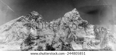 Vintage style black and white image of the world's highest mountain, Mt Everest (8850m) and Mt. Nuptse in the Himalayas, Nepal.
