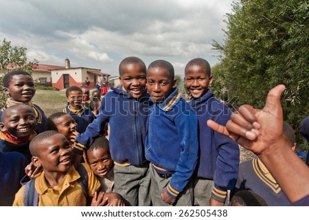 PIGGS PEAK, SWAZILAND-JULY 29: Unidentified Swazi schoolboys on July 29, 2008 in Nazarene Mission School, Piggs Peak, Swaziland. Close to 10% of the Swazi population are orphans, due to HIV/AIDS.