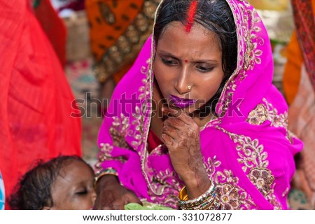 RAXAUL, INDIA - NOV 8: Unidentified Indian woman at the Hindu Chhath festival on Nov 8, 2013 in Raxaul, Bihar state, India. Hindu people in North India worship the Sun during the Chhath festival.