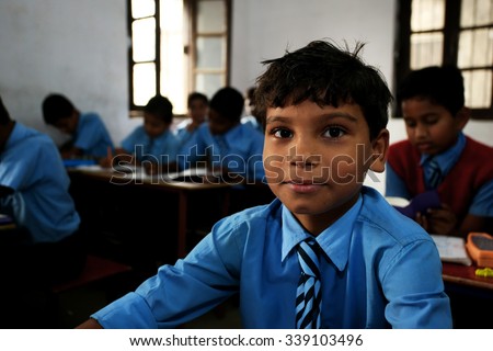 RAXAUL, INDIA - NOV 5: Unidentified Indian boys in a local school on Nov 5, 2011 in Raxaul, Bihar state, India. Bihar is one of the poorest states in India. The per capita income is 300 dollars.