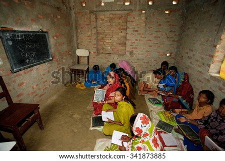 ADAPUR, INDIA - NOV 7: Unidentified Indian women in an adult school on Nov 7, 2011 in Adapur, Bihar state, India. Bihar is one of the poorest states in India. The per capita income is 300 dollars.