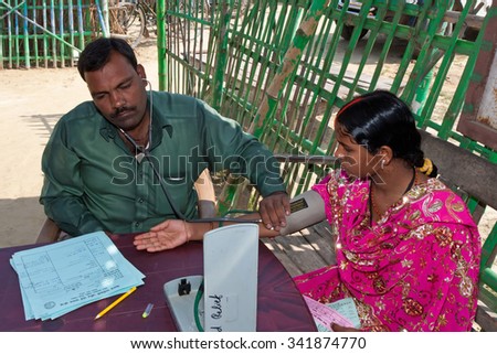 ADAPUR, INDIA-NOV 8: Indian woman examined at a rural pregnancy clinic on 8th Nov 2011 in Adapur, Bihar, India. Bihar is one of the poorest states in India. The per capita income is about 300 dollars.