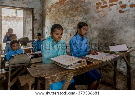 RAXAUL, INDIA - NOV 11: Unidentified Indian pupil in a local school on Nov 11, 2013 in Raxaul, Bihar, India. Bihar is one of the poorest states in India. The per capita income is about 300 dollars.