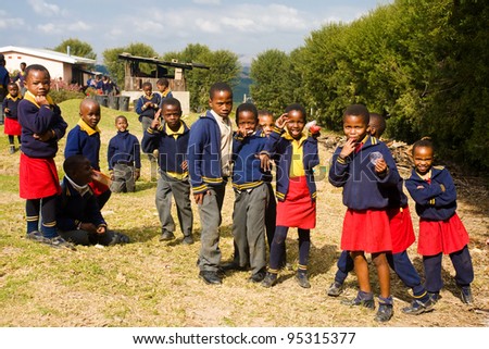 PIGGS PEAK, SWAZILAND-JULY 29: Unidentified Swazi pupils on July 29, 2008 in Nazarene Mission School, Piggs Peak, Swaziland. Close to 10% of Swaziland’s population are orphans, due to HIV/AIDS.