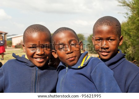 PIGGS PEAK, SWAZILAND-JULY 29: Unidentified Swazi schoolboys on July 29, 2008 in Nazarene Mission School, Piggs Peak, Swaziland. Close to 10% of Swaziland’s population are orphans, due to HIV/AIDS.