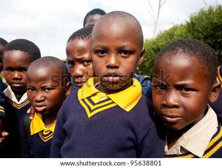 PIGGS PEAK, SWAZILAND-JULY 29: Unidentified Swazi schoolboys on July 29, 2008 in Nazarene Mission School, Piggs Peak, Swaziland. Close to 10% of Swaziland’s population are orphans, due to HIV/AIDS.