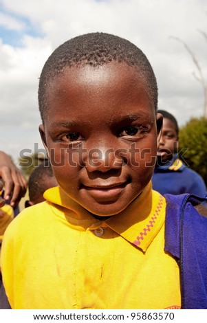 PIGGS PEAK, SWAZILAND-JULY 29: Unidentified Swazi schoolboy on July 29, 2008 in Nazarene Mission School, Piggs Peak, Swaziland. Close to 10% of Swaziland’s population are orphans, due to HIV/AIDS.
