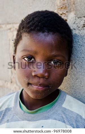 MBABANE, SWAZILAND- JULY 30: Portrait of unidentified Swazi boy on July 30, 2008 in Mbabane, Swaziland. Close to 10 percent of Swaziland’s total population are orphans, due to HIV/AIDS.