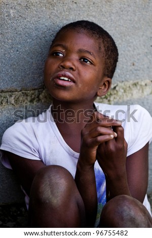 MBABANE, SWAZILAND- JULY 30: Portrait of unidentified Swazi girl on July 30, 2008 in Mbabane, Swaziland. Close to 10 percent of Swaziland’s total population are orphans, due to HIV/AIDS.