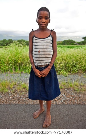 MANZINI, SWAZILAND-DEC 27: Portrait of unidentified Swazi girl on Dec 27, 2007 in a small village near Manzini, Swaziland. Close to 10% of Swaziland’s total population are orphans, due to HIV/AIDS.