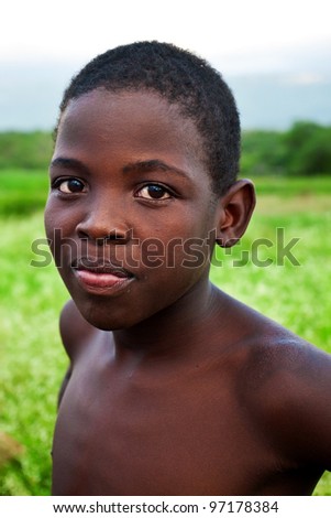 MANZINI, SWAZILAND-DEC 27: Portrait of unidentified Swazi boy on Dec 27, 2007 in a small village near Manzini, Swaziland. Close to 10% of Swaziland’s total population are orphans, due to HIV/AIDS.