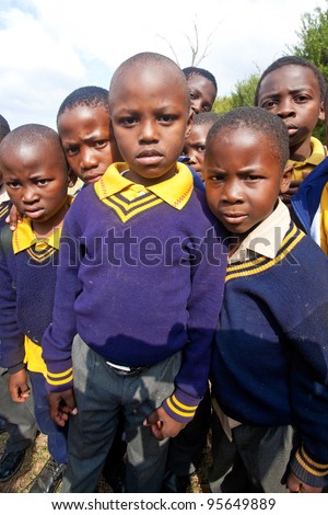 PIGGS PEAK, SWAZILAND-JULY 29: Unidentified Swazi schoolboys on July 29, 2008 in Nazarene Mission School, Piggs Peak, Swaziland. Close to 10% of Swaziland population are orphans, due to HIV/AIDS.