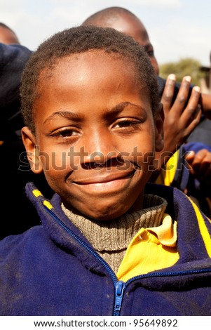 PIGGS PEAK, SWAZILAND-JULY 29: Unidentified Swazi schoolboy on July 29, 2008 in Nazarene Mission School, Piggs Peak, Swaziland. Close to 10% of Swaziland population are orphans, due to HIV/AIDS.
