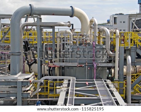 Industrial tanks, pipes, pumps, instrumentation, motor, cable racks,