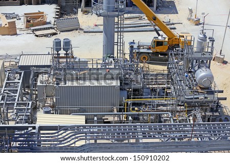 Industrial construction of a power plant showing a package boiler for auxiliary steam