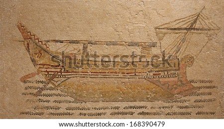 Ancient Roman mosaic from the beginning of the 3rd century depicting a stocky merchant ship was found at the threshold to the frigidarium of Themetra known as modern day Chott Merium in Tunisia