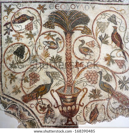 Beautiful ancient mosaic from the early Byzantine period depicting a palm tree and birds.