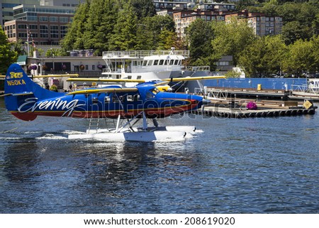 Seattle, Washington - JULY 6, 2014: Kenmore Air seaplane on Lake Union. Kenmore Air, a family-run Seattle seaplane airline with a warm and effortless approach to hospitality