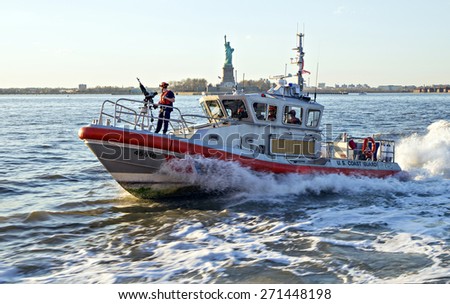 NEW YORK CITY, USA - APRIL 19: U.S. Coast Guard boat patrolling the Hudson River bay. April 19, 2015 in New York City, USA