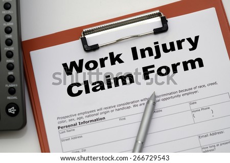 Claim form for a work injury on a desk top