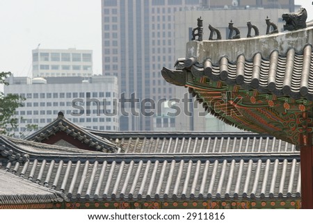 Roof of traditional east house and the foreground, on a background - skyscrapers
