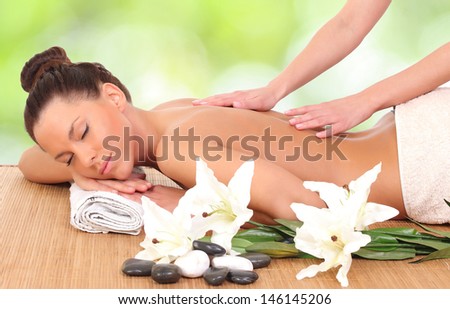 Beautiful woman enjoying a massage therapy