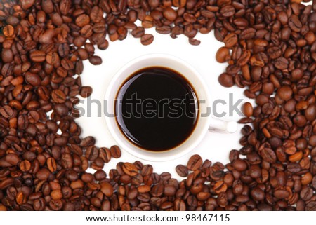 Cup with coffee. costing on coffee grain