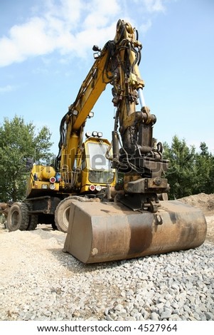 Back-hoe - in this case used for quick removal of railroad tracks and sleepers.