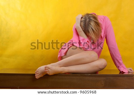 woman in stress or deep depression, yellow background
