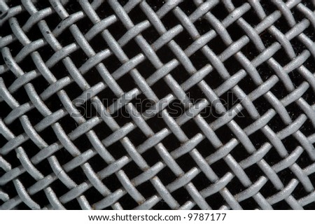 gray glitter metallic grating, close-up, black background