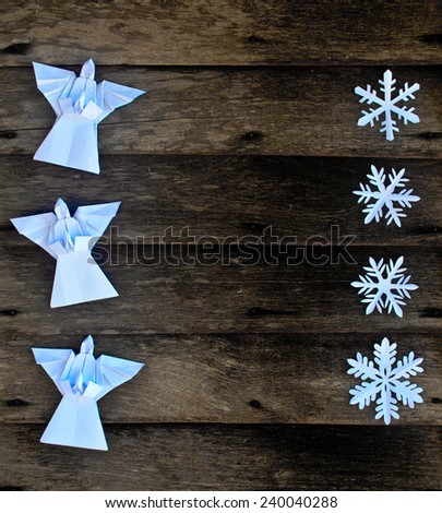 Merry Christmas card with Angels and snowflake decorations in paper cutting and  origami style