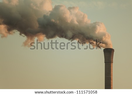 Vintage styled image of air pollution from a factory pipe