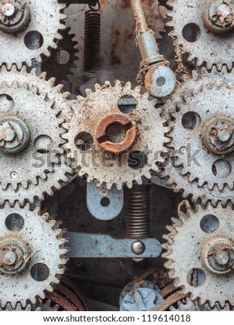 Old dirty weathered cogwheels of an industrial machine
