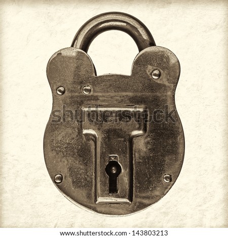 Retro styled sepia image of an antique brass padlock