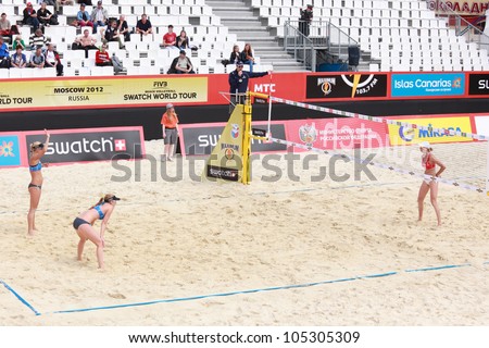 MOSCOW, RUSSIA - JUNE 8: Kolocova (leans on knees) - Slukova (left), Czech Republic vs Ukolova - Khomyakova (right), Russia, during Beach Volleyball Swatch World Tour in Moscow, Russia at June 8, 2012