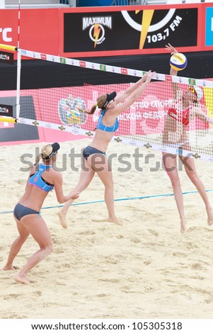MOSCOW, RUSSIA - JUNE 8: Kolocova (center) and Slukova (left), Czech Republic vs Ukolova and Khomyakova (right), Russia, during Beach Volleyball Swatch World Tour in Moscow, Russia at June 8, 2012