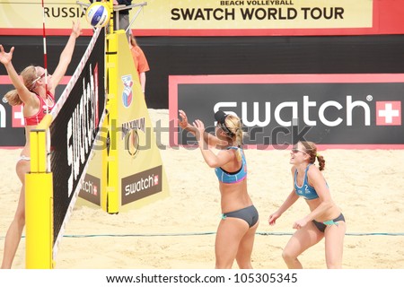 MOSCOW, RUSSIA - JUNE 8: Kolocova (right) and Slukova (center), Czech Republic vs Ukolova (left) and Khomyakova, Russia, during Beach Volleyball Swatch World Tour in Moscow, Russia at June 8, 2012