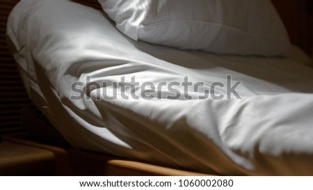 Adjustable bed closeup with raised head