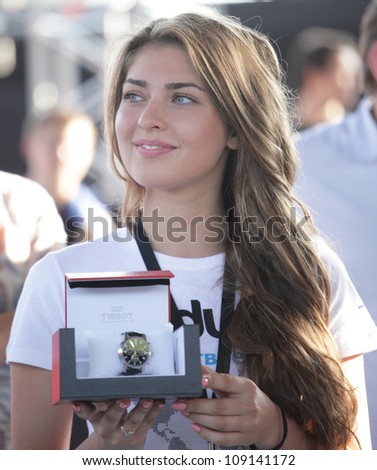 MOSCOW, RUSSIA - JULY 28: Girl holding prize for winners during International Street Basketball Cup \